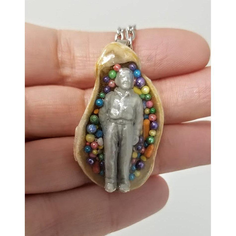 Seashell pendant with miniature human figure and candy sprinkles in layered resin // Includes 18