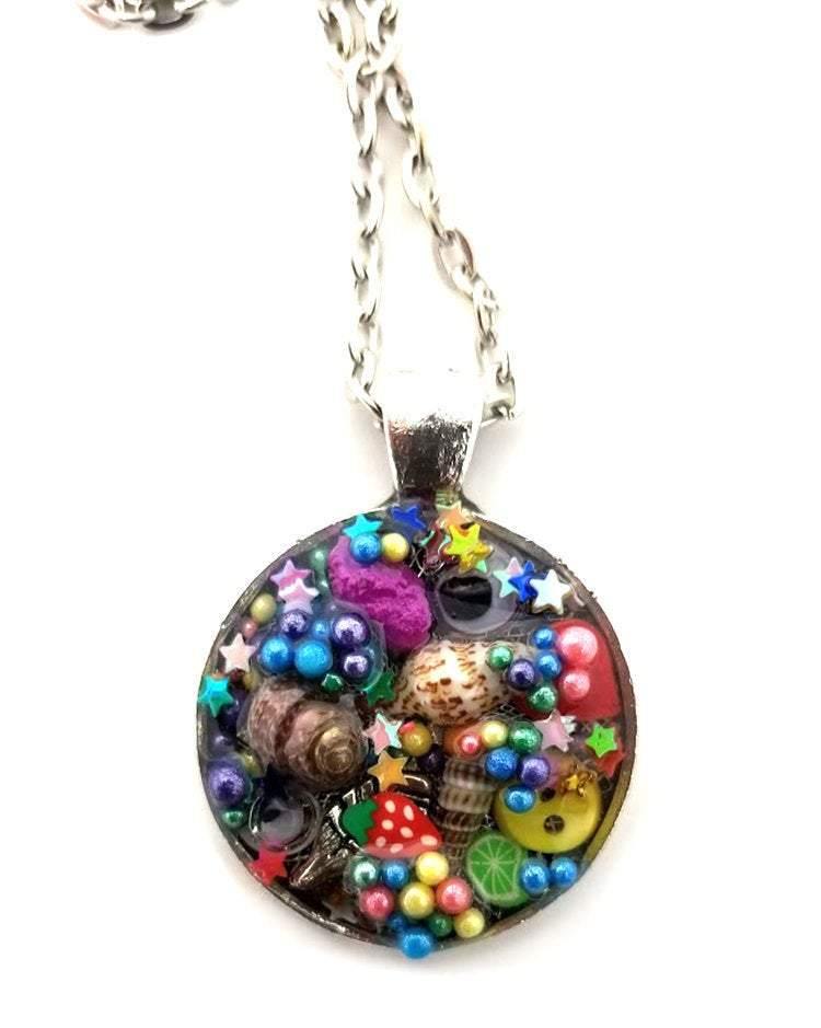 Resin pendant containing variety of unique found objects - Includes 18