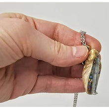 Load image into Gallery viewer, Seashell pendant with miniature human figure and candy sprinkles in layered resin // Includes 18&quot; chain - Curio Memento
