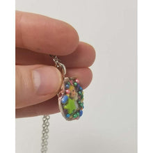 Load image into Gallery viewer, Seashell pendant created using antique miniature angel, candy sprinkles, sequins and resin. Includes 18&quot; chain - Curio Memento
